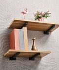 Heavy Duty Floating Shelf Brackets 30 Cm Black 2 Pack Wall Mounted Iron Supports Built Different Steel Corner Braces For Bookshelves with books and decorative items.