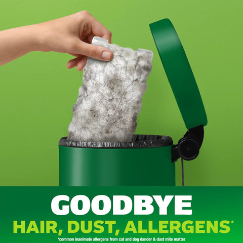 Hair Magnet Deluxe Starter Kit With Collapsible Pole And 9 Dry Cloths Plus 2 Bonus Mop And Go Wet Cloths For Quick Cleanups Hair And Dust Pickup And Pet Fur Removal showing used cloth being disposed in green bin