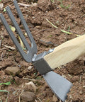 Two In One Garden Hoe And Digging Fork With Wooden Handle For Weeding Digging And Soil Loosening Carbon Steel Blade in soil