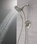 Linden 17 Series Dual Function Shower Faucet Kit With 4 Spray In2ition 2 In 1 Handheld Shower Head And Hose Stainless Finish T17293 SS I Valve Not Included showing water flow with tiled wall background