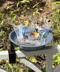 No Bull Fully Adjustable Deck Mounted Birdbath With Secure Grip Rail Clamps Pretty Darn Sturdy Gray Metal Bowl with birds bathing.