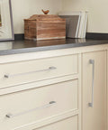 Installed Cityscape Satin Nickel Cabinet Pull Center-To-Center Ten And One Sixteenth Inch Pack of 10 on kitchen drawers