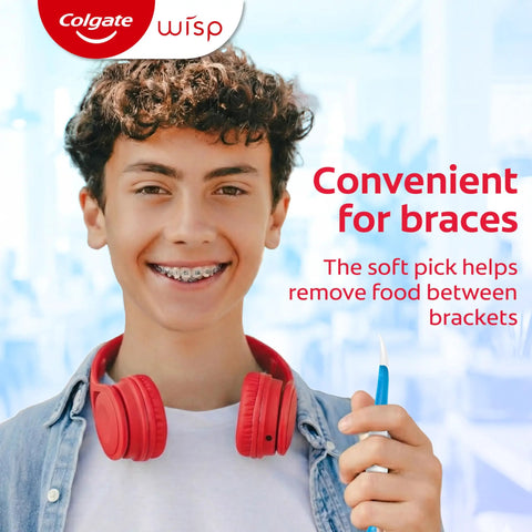 Teen with braces using soft pick from Max Fresh Wisp Disposable Mini Travel Toothbrushes Peppermint Pack Of 24 No Water Needed