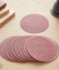 Super Cool 5 inch Mesh Sanding Discs With Hook And Loop Backing, 240 Grit Fine Aluminum Oxide For Wood and Metal Project Dust Free Set of 50 on wooden surface.