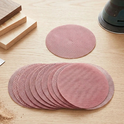 Super Cool 5 inch Mesh Sanding Discs With Hook And Loop Backing, 240 Grit Fine Aluminum Oxide For Wood and Metal Project Dust Free Set of 50 on wooden surface.