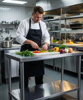 Premium 40x20 Stainless Steel Work Table Beefy Frame Heavy Duty Prep Station With Lower Shelf 600 Pound Capacity in commercial kitchen.