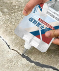 Application of Pro Grade Rock Solid Concrete Crack Sealant Waterproof Masonry Repair Adhesive on driveway crack.