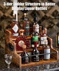 Three Tier Wooden Liquor Display Shelf For Home Bar 3 Step Countertop Rack For Bottles Whiskey Vodka And Spirits Retro Style Mini Bar Organizer Sturdy Wood Stand showcasing various liquor bottles on a countertop bar
