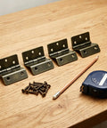 Four Pack Half Surface Hinges 270 Degree Tri Fold Retro Iron Cabinet Hinges Bronze Finish visible with screws on table