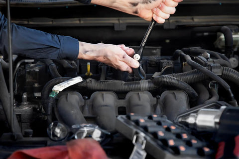 Mechanic using Two Piece Indexing Pry Bar Set With 8 Inch And 16 Inch Bars, Heads Rotate 180 Degrees Through 14 Locking Positions in engine bay