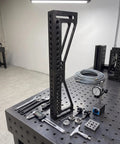 Built Tough 12 Inch Welding Clamping Square And Table Extension Kit Featuring Precision Machined 90 Degree Positioning Riser Blocks on metal table.