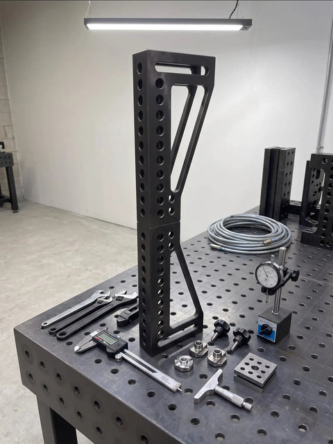 Built Tough 12 Inch Welding Clamping Square And Table Extension Kit Featuring Precision Machined 90 Degree Positioning Riser Blocks on metal table.