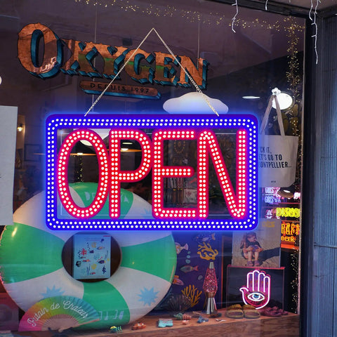 Storefront window with 16.5 By 9 Inch Horizontal LED Open Sign For Biz, Ultra Bright And Dimmable Store Sign Displayed