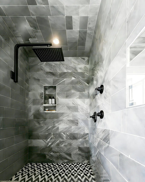 High Rise Shower Arm And Flange 16 Inch Solid Brass Square Shower Riser Gooseneck Wall Mount Extension Arm Half Inch NPT Tapered Threads Matte Black Rock Solid installed in tiled bathroom