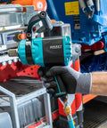 Heavy Duty Air Impact Wrench with detachable handle, held in hand, ideal for automotive repair, showcasing twin turbo engineering.