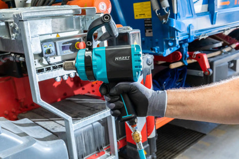 Heavy Duty Air Impact Wrench with detachable handle, held in hand, ideal for automotive repair, showcasing twin turbo engineering.