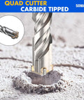 SOMADA 1in x 39in SDS Plus long drill bit with four carbide cutters; front view drilling into concrete.