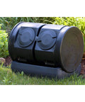 Compost Wizard Dual Tumbler Bin for Outdoor Garden with 7 Cu Ft Total Capacity Two 25 Gallon Chambers Easy No Fuss Maintenance and a Five Gallon Tea Collection Base - front view in garden