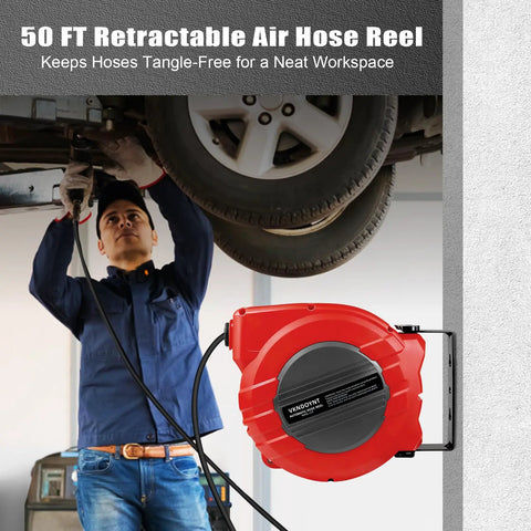 Person using Retractable Air Hose Reel With One Quarter Inch By Fifty Feet Hybrid Polymer Hose, Auto Rewind, wall-mounted, dark gray and red.