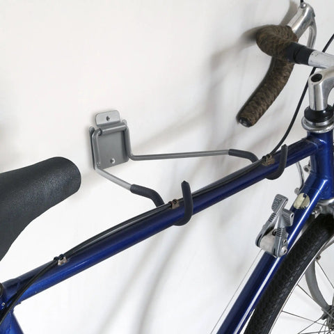 Heavy Duty Bike Wall Mount With EVA Foam Padding And 50lb Capacity holding blue bike on wall, sturdy steel construction
