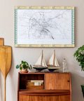 Travel The Map Bulletin Board Border With Globes For Classroom And Home Office Decor on a wooden wall above model ships