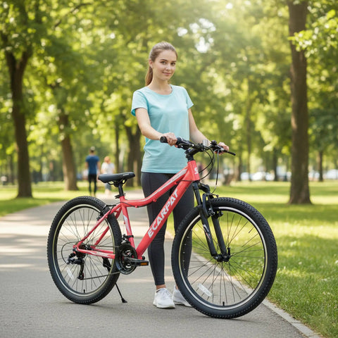 Woman with a 24 Inch Female Mountain Bike With Dual V Brakes 21 Speed Shifter High Carbon Frame And Front Suspension Fork in park