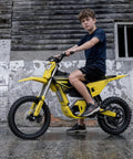 Heavy Duty Electric Dirt Bike Two Pack Crafted For Teens And Adults Packing 5500W motors, rider on yellow dirt bike.