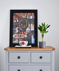 Matte Black Zinc Kitchen Cabinet Knobs And Drawer Pulls Set, 30 Pack displayed on light gray dresser with framed artwork.