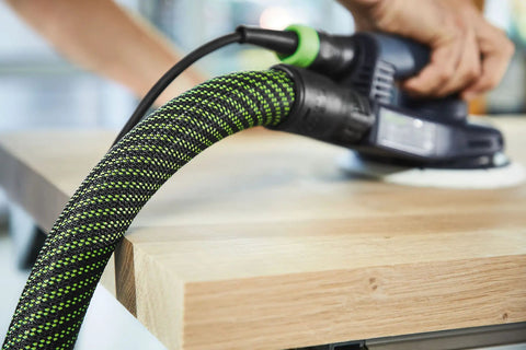 Suction Hose 27/32 Inch By 3.5 Meter AS CTR For Dust Collection And Power Tool Applications connected to sander on wood surface