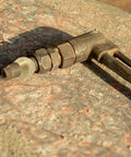 Brass compression sleeve ferrule (1/8 in) on metal tubing; close-up view