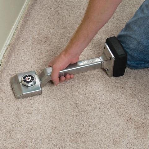Using Deluxe Knee Kicker For Carpet Stretching With Foam Knee Pad Impact Guard, Adjustable 17 To 21 Inch Handle on carpet