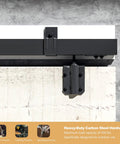 Close-up view of Beefy 13Ft Industrial Grade Black Double Door Track Kit for exterior sliding barn doors, mounted on a wall.
