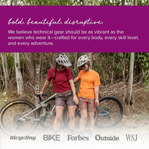 Two women next to a bike wearing 2.0 Padded High Rise Biker Shorts For Women With Waistband Free Design And Softer Compression.