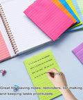 Nine Pack 4x6 Inch Lined Sticky Notes With Lines In Nine Bright Colors Large Ruled Self Adhesive Note Pads 35 Sheets Per Pad Ideal For Office And Home Organization To Do Lists Notes And Quick Reminders, showing colorful pads and a person writing on a green note.