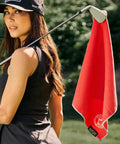 Woman holding club with Greenside Magnetic Golf Towel Ultra Absorbent Microfiber Sidekick in red waffle weave pattern.