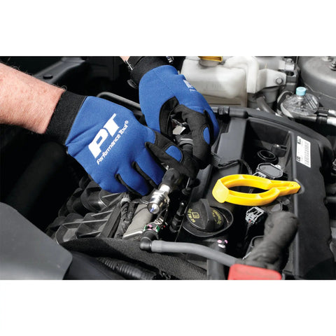 Heavy Duty Spark Plug Wire Pliers For Safe Removal used by mechanic, wearing gloves, extracting wire from engine.