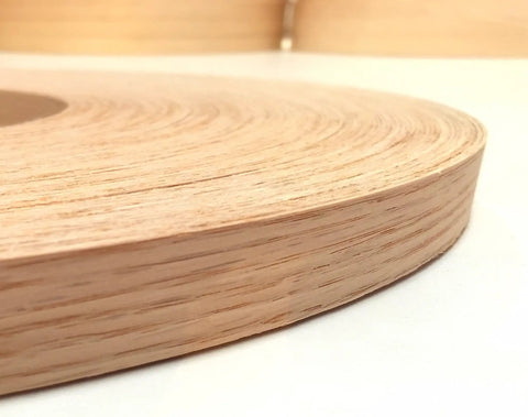 Close-up of Red Oak Edge Banding Tape Roll 1-1/2 In X 50 Ft, Pre-Glued Iron-On Wood Veneer With Hot Melt Adhesive, Smooth Sanded Finish.