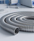Kickass Stainless Steel Flexible Metal Conduit For Wire Protection 1 Inch X 9.8 Feet coiled tubing on a workshop table.
