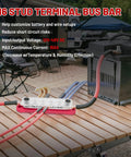 Heavy Duty 150 Amp 12V Bus Bar With Cover Rock Solid M6 Studs for clean wire setup on a wooden table with connections.