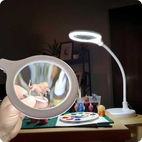 LightView Pro Flex 2 in 1 Magnifying Desk Lamp With 1.75x LED Light Magnifier Flexible Gooseneck For Crafts Reading Close Work Hands Free Task Lighting illuminating miniature painting table.