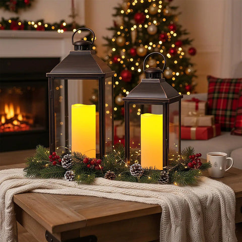 2 Pack 10 Inch Outdoor Flameless LED Candles With Remote Control in lanterns with holiday decor on a table