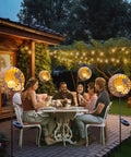 Outdoor dinner setting with Solar Fairy Garden Lights Moon Star Glass Globe Pathway Stakes Waterproof Outdoor Decor on patio
