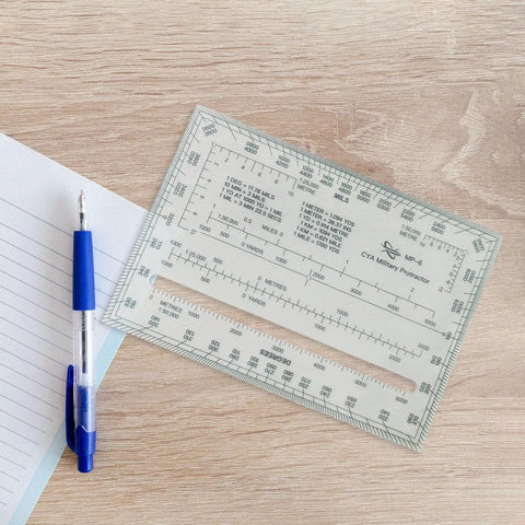 Dope Acrylic Square Ruler With Coordinate Grid Reader showcasing map scales on wooden surface with pen and paper nearby.
