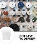 White Plastic Hole Plugs Set With Locking Screw Caps For Furniture And Office Installations on display with various attachments