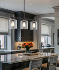 Dope Three Light Modern Industrial Farmhouse Kitchen Island Pendant Lighting With Clear Glass Cylinder Shades in kitchen