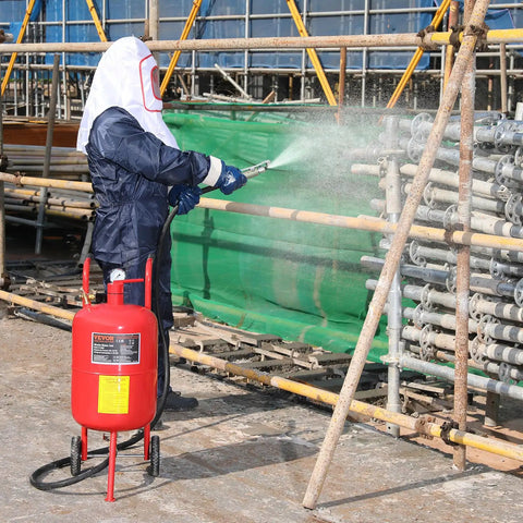 Person using Powerful 10 Gallon Sandblaster Kit With 125 PSI Pressure For Fast Paint Rust Stain Removal on metal structure