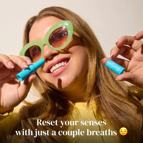 Woman holding Motion And Morning Sickness Nausea Relief Inhaler No Pills Needed Fast Acting Drug Free Pocket Sized 2 Inhalers