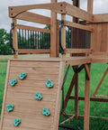 Cedar Wood Swing Set With Wave Slide And Raised Clubhouse Plus Balcony, featuring wooden climbing wall and balcony.