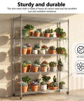 Rock Solid Heavy Duty Adjustable Five Tier Wire Shelving Rack With Smooth Rollin Casters and Hella Durable 331 Lb Weight Load Capacity For Garage Workspaces And Storage Areas holding potted plants.