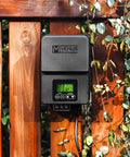 Outdoor Low Voltage Transformer 300W With Astronomical Timer And Built In Photo Sensor For Landscape Lighting mounted on wooden fence